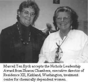 Marceil Ten Eyck accepts the Nichols Leadership Award from Sharon Chambers, executive director of Residence XII, Kirkland, Washington, treatment center for chemically dependent women.